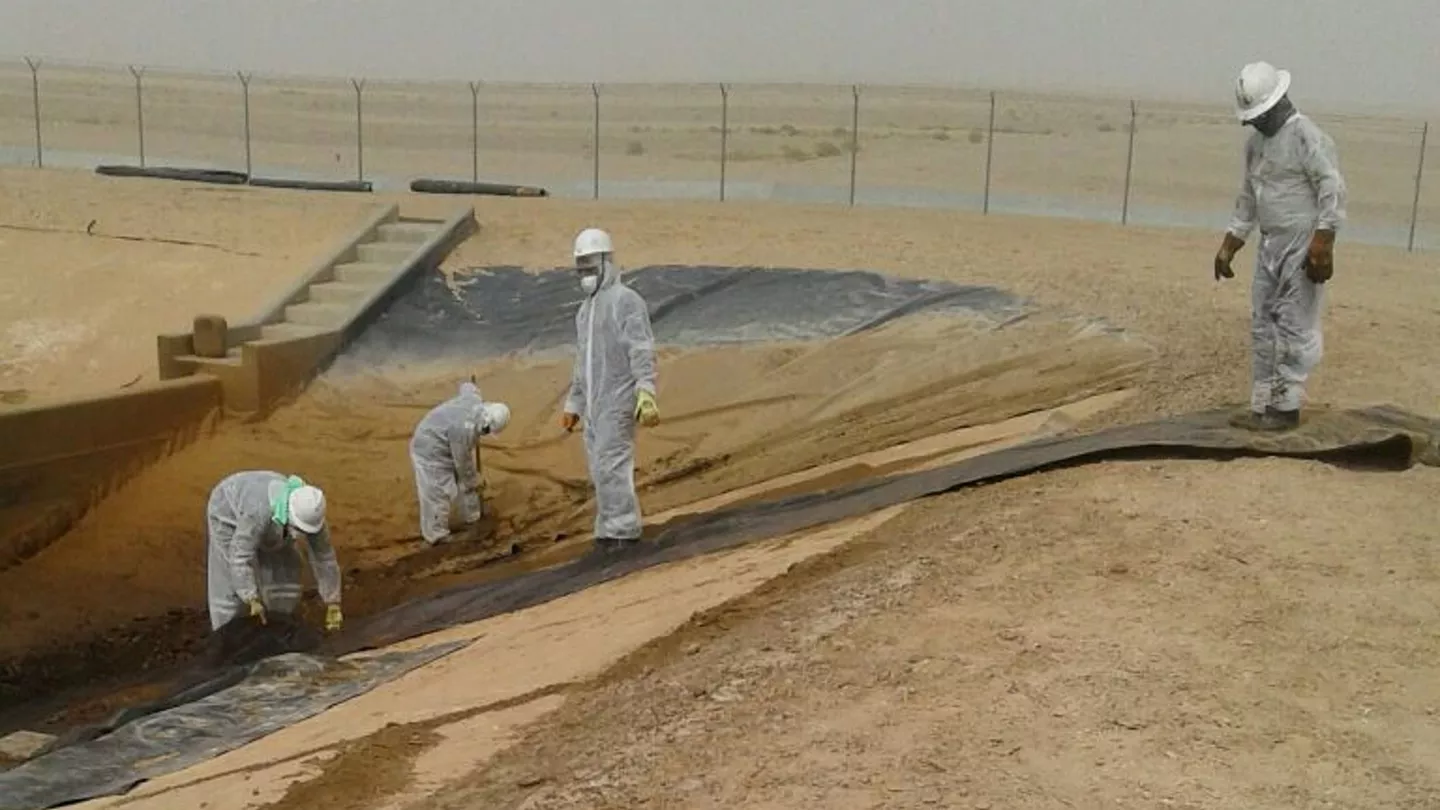 Workers collect 3,500 kilograms of used high-density polyethylene liner from the Haradh Gas Plant evaporation pond for recycling into pellets to be mixed with raw materials for manufacturing plastic products.